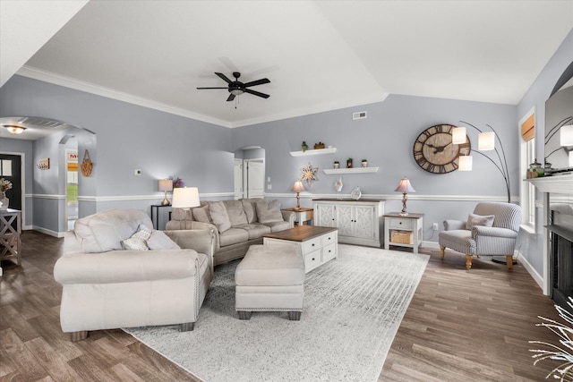 1101 Rosabella, Greer, SC 29651 - living area with arched walkways, a fireplace, wood finished floors, ceiling fan, and vaulted ceiling