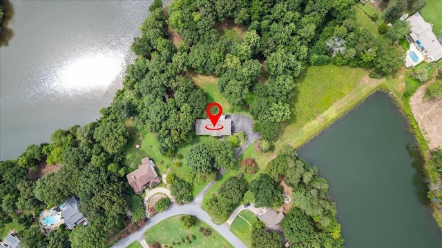 aerial view of property and surrounding area featuring a large body of water
