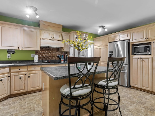 112 Scruggs, Gaffney, SC 29341 - kitchen featuring stainless steel appliances, stone finish floors, a kitchen breakfast bar, and dark countertops