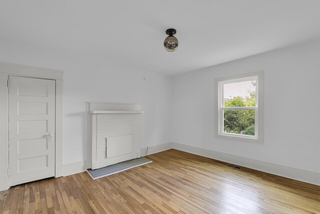 10 Beech, Spartanburg, SC 29303 - unfurnished living room featuring light wood finished floors and baseboards