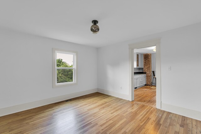 10 Beech, Spartanburg, SC 29303 - empty room featuring light wood-style floors and baseboards