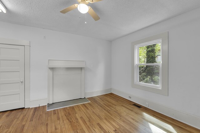 10 Beech, Spartanburg, SC 29303 - spare room featuring light wood-style flooring, a textured ceiling, a ceiling fan, and baseboards