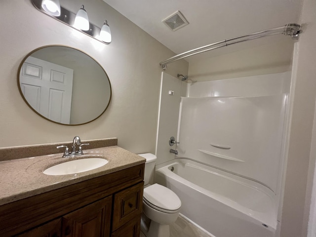 bathroom with toilet, vanity, and bathtub / shower combination