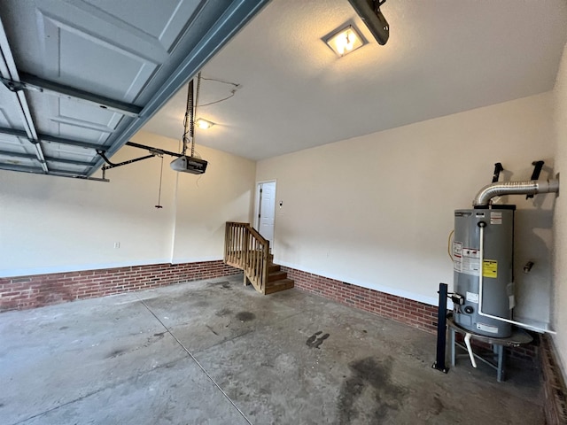 garage featuring water heater and a garage door opener