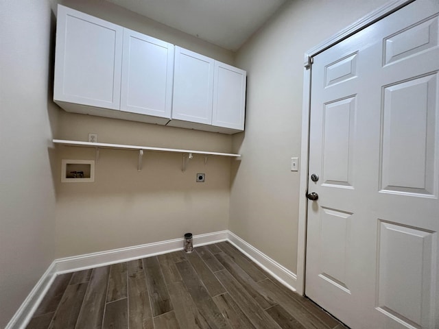 laundry room featuring hookup for an electric dryer, baseboards, dark wood finished floors, hookup for a washing machine, and cabinet space