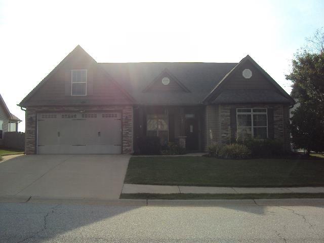 108 Dewfield, Boiling Springs, SC 29316 - view of front of home with driveway, a garage, and stone siding