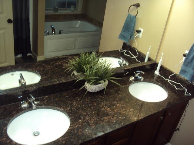 108 Dewfield, Boiling Springs, SC 29316 - bathroom featuring double vanity and a garden tub