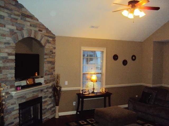 108 Dewfield, Boiling Springs, SC 29316 - living area featuring vaulted ceiling, a ceiling fan, a stone fireplace, and arched walkways