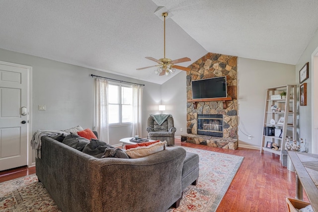 213 Mystic, Chesnee, SC 29323 - living room with a ceiling fan, a fireplace, a textured ceiling, vaulted ceiling, and wood finished floors