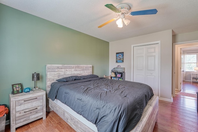 213 Mystic, Chesnee, SC 29323 - bedroom with wood finished floors, a closet, baseboards, ceiling fan, and a textured ceiling