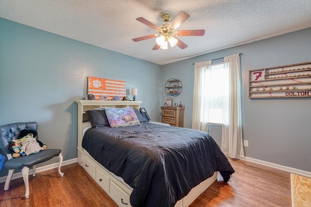 213 Mystic, Chesnee, SC 29323 - bedroom featuring wood finished floors, a textured ceiling, baseboards, and ceiling fan