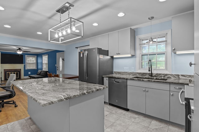 800 Woodlawn, Belmont, NC 28012 - kitchen featuring stainless steel appliances, ornamental molding, dark stone countertops, healthy amount of natural light, and a kitchen island