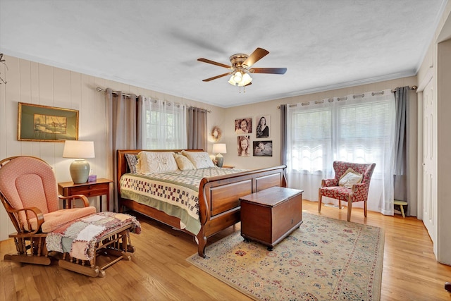 7 Hearthstone, Landrum, SC 29356 - bedroom with light wood-type flooring, crown molding, and a ceiling fan