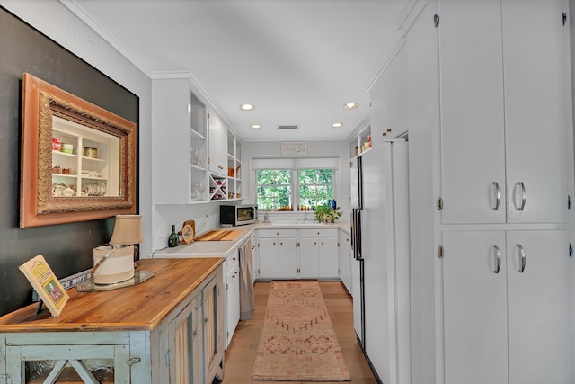 7 Hearthstone, Landrum, SC 29356 - kitchen with freestanding refrigerator, open shelves, stainless steel microwave, white cabinets, and dishwashing machine