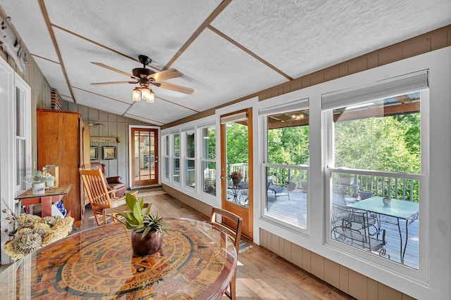 7 Hearthstone, Landrum, SC 29356 - sunroom featuring vaulted ceiling, wood finished floors, wood walls, a textured ceiling, and a deck