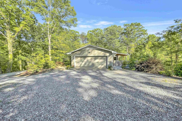 7 Hearthstone, Landrum, SC 29356 - view of side of home featuring driveway and a forest view