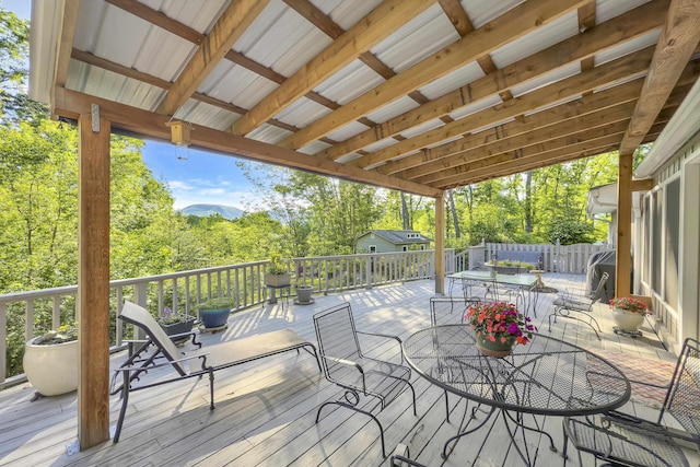 7 Hearthstone, Landrum, SC 29356 - wooden terrace featuring outdoor dining space and view of wooded area