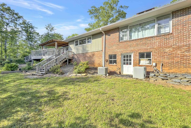 7 Hearthstone, Landrum, SC 29356 - rear view of property featuring central air condition unit, stairway, a deck, a yard, and brick siding
