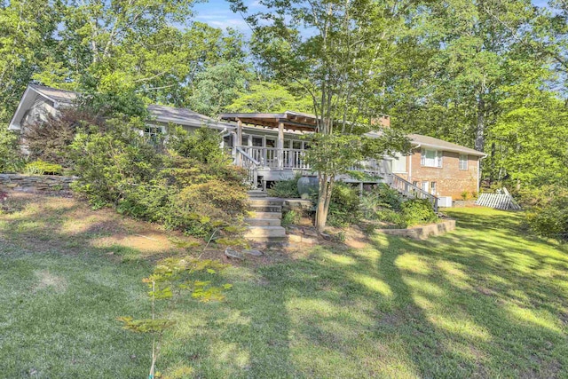 7 Hearthstone, Landrum, SC 29356 - rear view of property featuring stairway and a yard