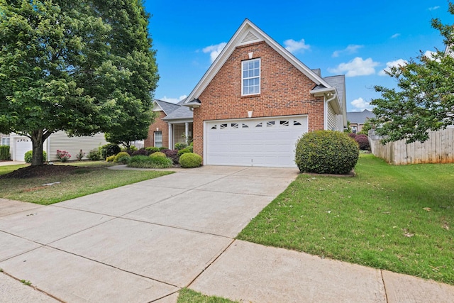 616 W Farrell, Woodruff, SC 29388 - traditional home with brick siding, concrete driveway, and a garage