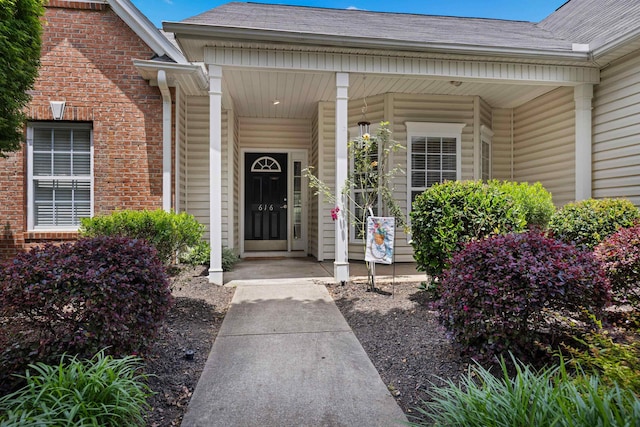 616 W Farrell, Woodruff, SC 29388 - entrance to property featuring brick siding, covered porch, and a shingled roof