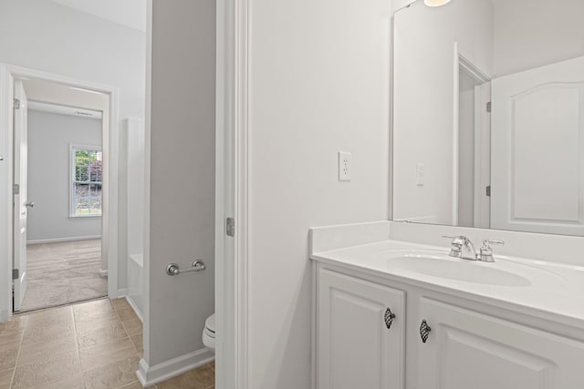 616 W Farrell, Woodruff, SC 29388 - full bathroom with toilet, vanity, baseboards, and a bath