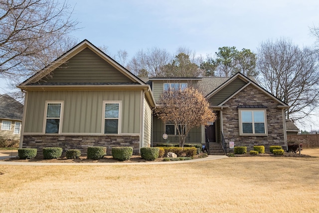 110 Coal Crk, Boiling Springs, SC 29316 - view of front facade featuring stone siding, board and batten siding, covered porch, and a front lawn