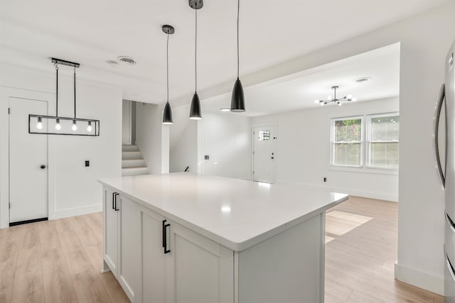 215 Blalock Rd, Boiling Springs, SC 29316 - kitchen featuring a center island, light wood-type flooring, decorative light fixtures, and baseboards