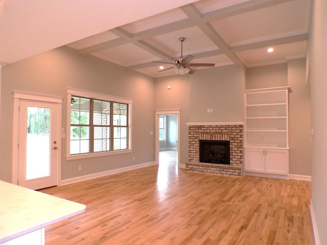 291 Robbins, Chesnee, SC 29323 - unfurnished living room with ceiling fan, coffered ceiling, light wood-type flooring, beamed ceiling, and baseboards