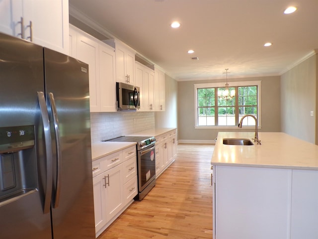 291 Robbins, Chesnee, SC 29323 - kitchen with stainless steel appliances, a sink, ornamental molding, recessed lighting, and light wood finished floors