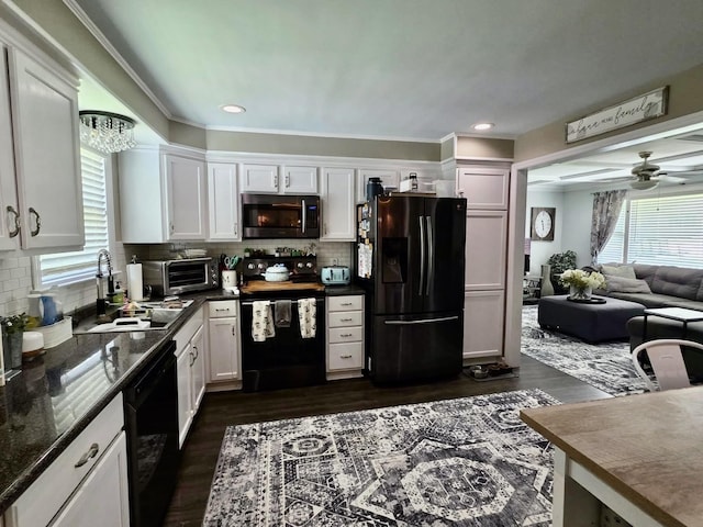 719 Magness Dr, Spartanburg, SC 29303 - kitchen featuring black appliances, a sink, white cabinetry, decorative backsplash, and crown molding