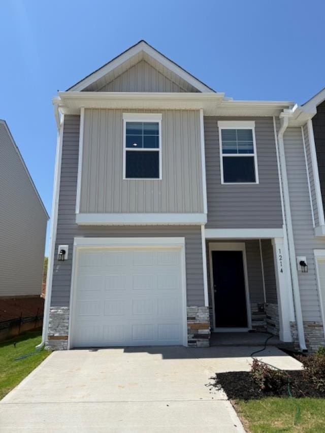 1214 Forestbrook, Spartanburg, SC 29303 - view of front of house with stone siding, concrete driveway, a garage, and board and batten siding
