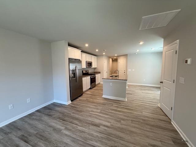 1214 Forestbrook, Spartanburg, SC 29303 - kitchen with appliances with stainless steel finishes, wood finished floors, recessed lighting, and baseboards