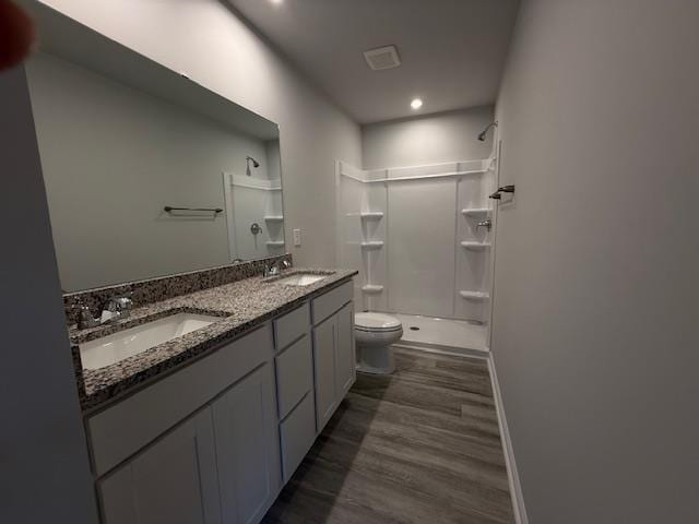 1214 Forestbrook, Spartanburg, SC 29303 - full bathroom with toilet, a shower, double vanity, wood finished floors, and recessed lighting