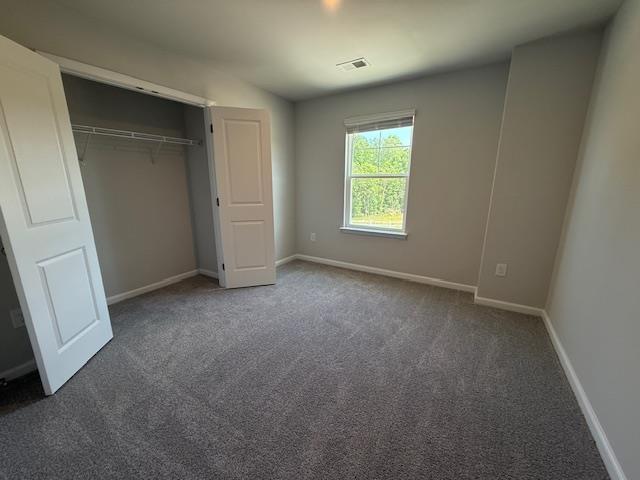 1214 Forestbrook, Spartanburg, SC 29303 - unfurnished bedroom featuring carpet floors, baseboards, and a closet