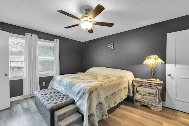 469 Royal Oak, Spartanburg, SC 29302 - bedroom featuring wood finished floors, a textured ceiling, a ceiling fan, and baseboards