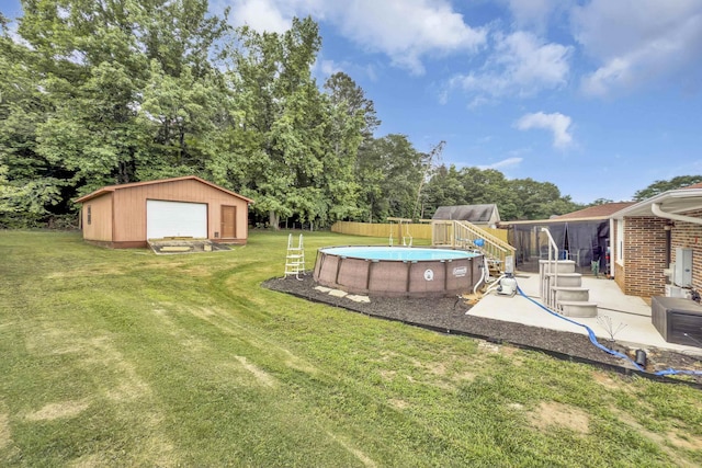 469 Royal Oak, Spartanburg, SC 29302 - view of yard featuring a garage, an outbuilding, an outdoor pool, and view of wooded area