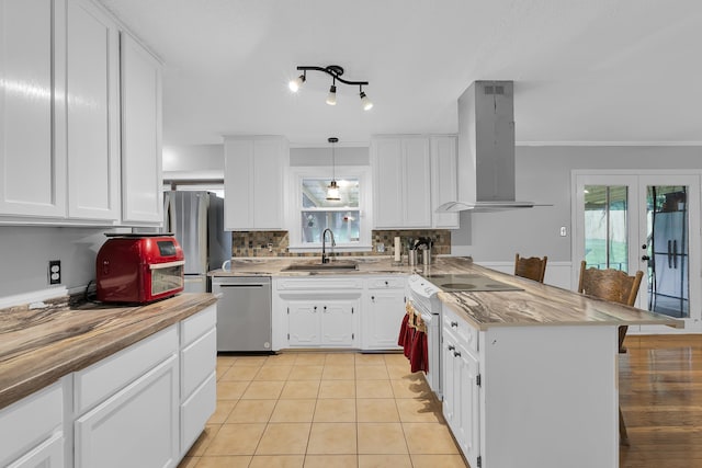 469 Royal Oak, Spartanburg, SC 29302 - kitchen featuring appliances with stainless steel finishes, ventilation hood, a sink, french doors, and a peninsula