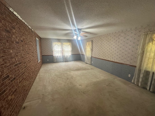 148 Southland, Boiling Springs, SC 29316 - empty room featuring wallpapered walls, wainscoting, a textured ceiling, a ceiling fan, and carpet floors