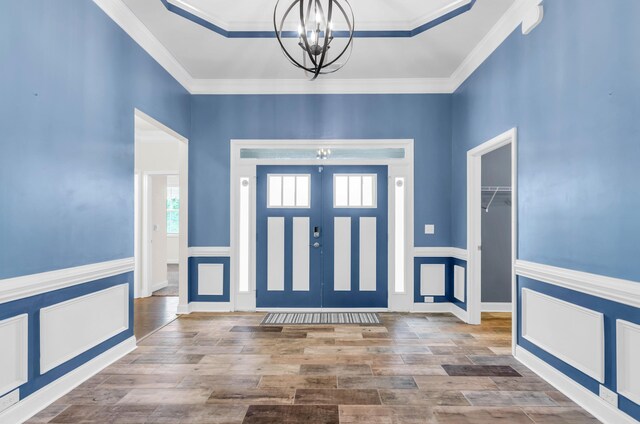 267 Santa Ana, Duncan, SC 29334 - entrance foyer featuring a chandelier, wood finished floors, a wainscoted wall, and crown molding