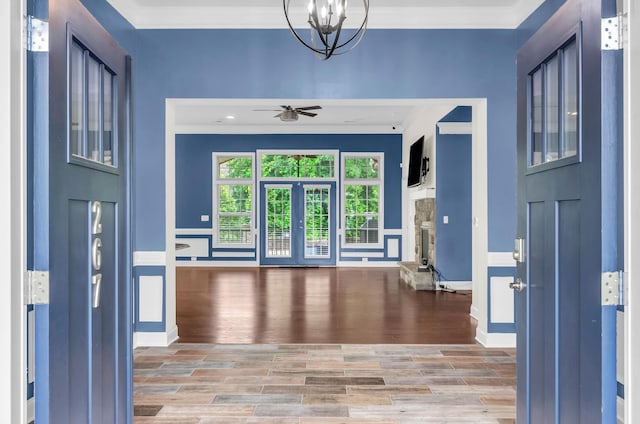 267 Santa Ana, Duncan, SC 29334 - entrance foyer with crown molding, wood finished floors, ceiling fan, a chandelier, and baseboards