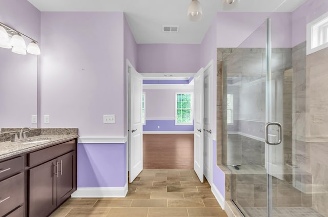 267 Santa Ana, Duncan, SC 29334 - full bathroom with vanity, baseboards, a stall shower, and wood finished floors