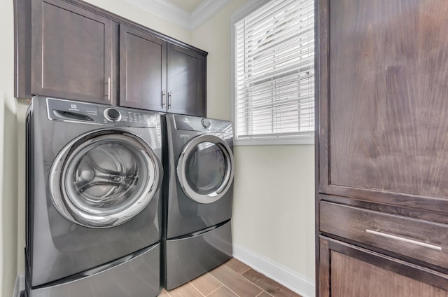 267 Santa Ana, Duncan, SC 29334 - laundry area with cabinet space, washer and dryer, baseboards, ornamental molding, and wood finished floors