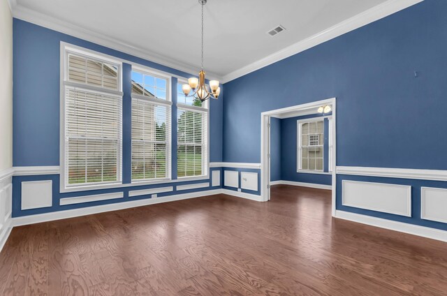 267 Santa Ana, Duncan, SC 29334 - empty room with a chandelier, wood finished floors, crown molding, and wainscoting