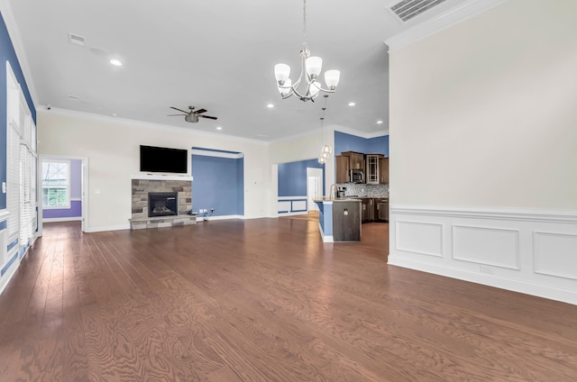 267 Santa Ana, Duncan, SC 29334 - unfurnished living room with ceiling fan, a fireplace, crown molding, a chandelier, and recessed lighting
