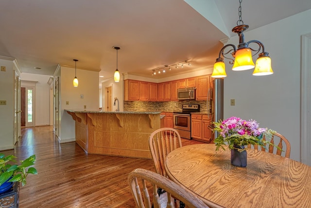 201 Woodridge, Spartanburg, SC 29301 - dining room featuring light wood-type flooring and ornamental molding