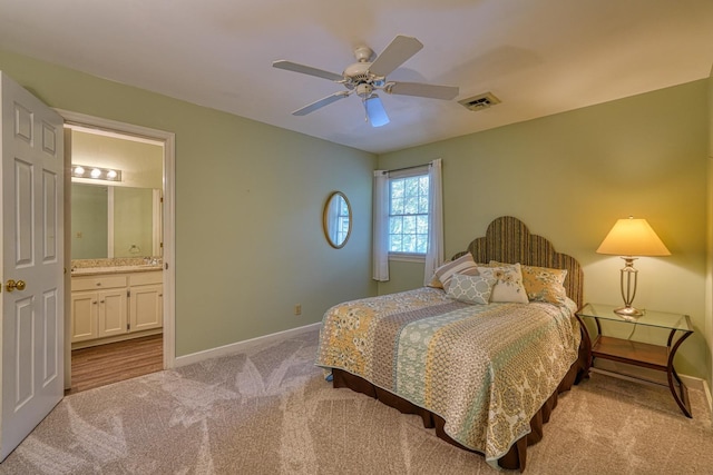 201 Woodridge, Spartanburg, SC 29301 - carpeted bedroom with baseboards, ensuite bathroom, and ceiling fan