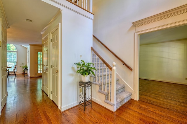 201 Woodridge, Spartanburg, SC 29301 - stairs featuring wood finished floors, ornamental molding, and baseboards