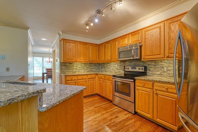 201 Woodridge, Spartanburg, SC 29301 - kitchen featuring stainless steel appliances, light wood-style flooring, ornamental molding, tasteful backsplash, and light stone countertops