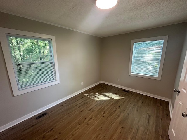 121 Pacolet, Gaffney, SC 29340 - empty room featuring healthy amount of natural light, a textured ceiling, baseboards, dark wood-style floors, and crown molding